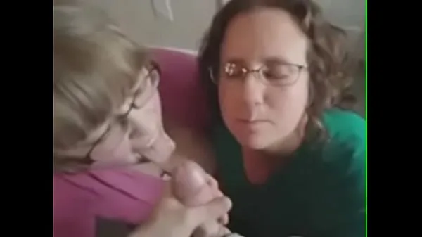 Two amateur blowjob chicks receive cum on their face and glasses Tiub segar panas
