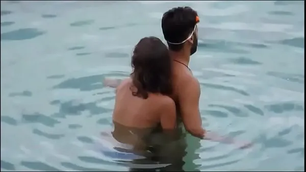 Hete Girl gives her man a reacharound in the ocean at the beach - full video xrateduniversity. com verse buis